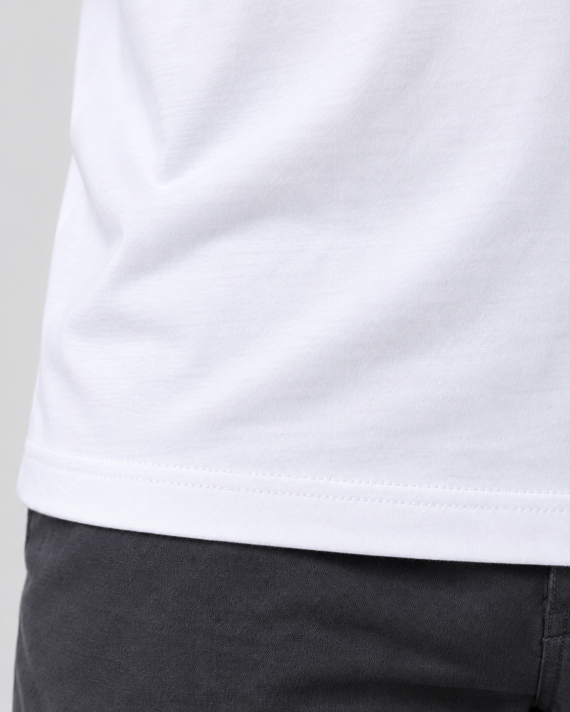 Camiseta Algodão Peruano Mesa de Encontro — detalhe da barra